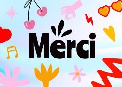 The word merci is surrounded by hearts and other objects.