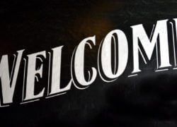 A sign with the word welcome on it.