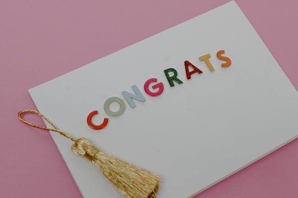 Congratulations card with a gold tassel.